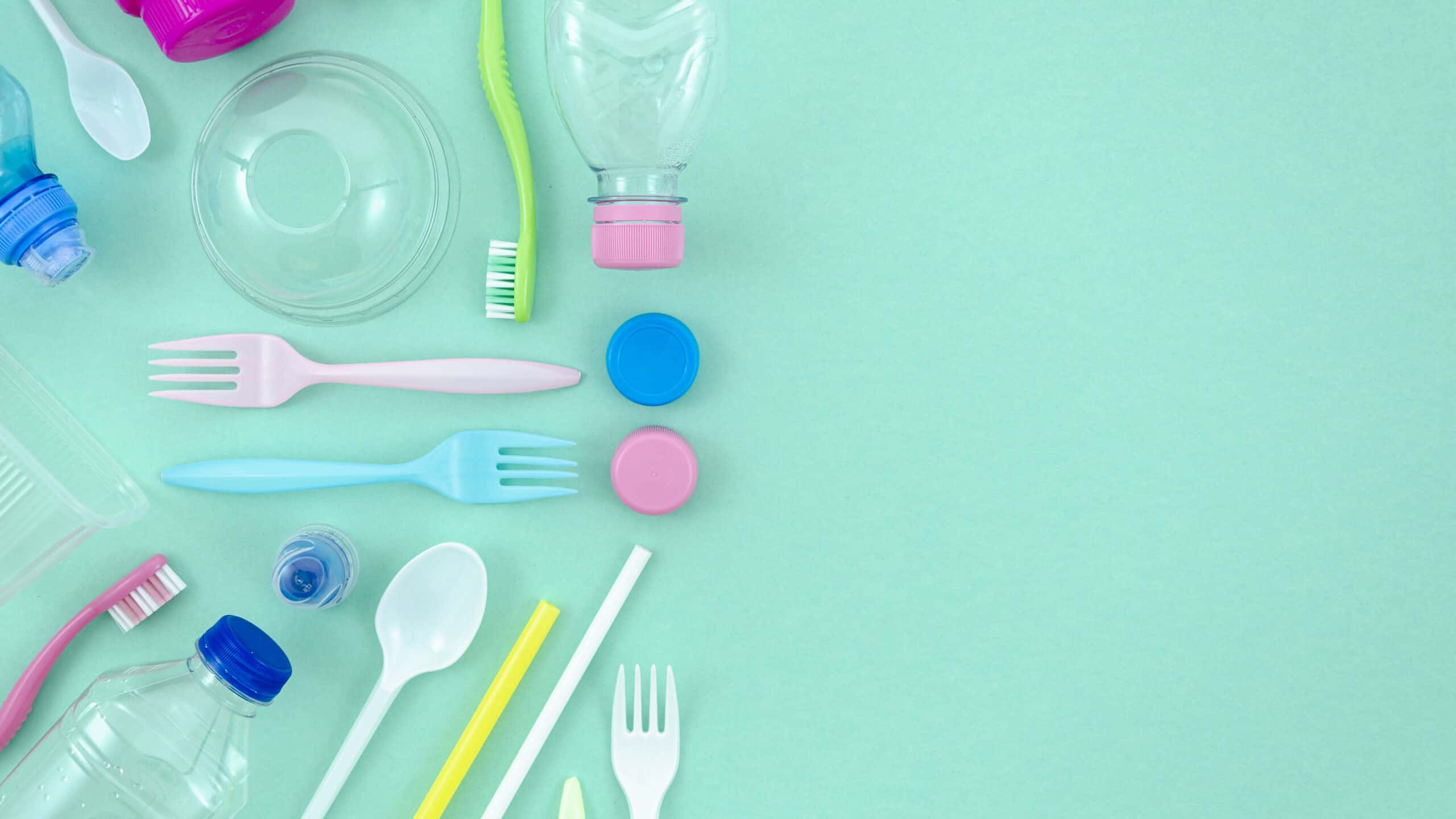 colorful-plastic-tableware-turquoise-background