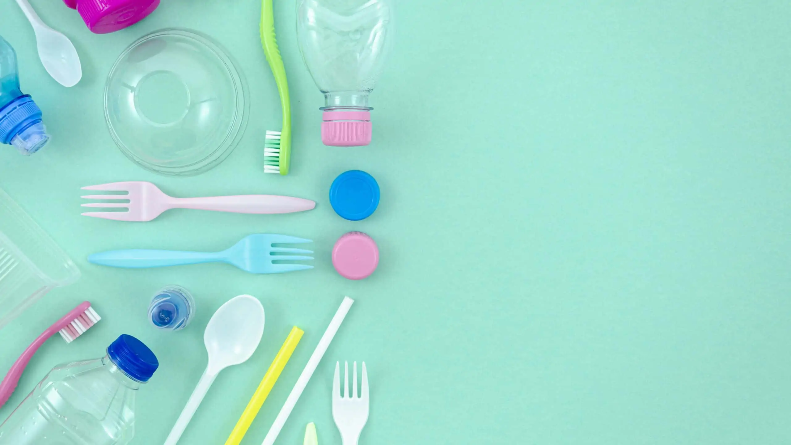 colorful-plastic-tableware-turquoise-background